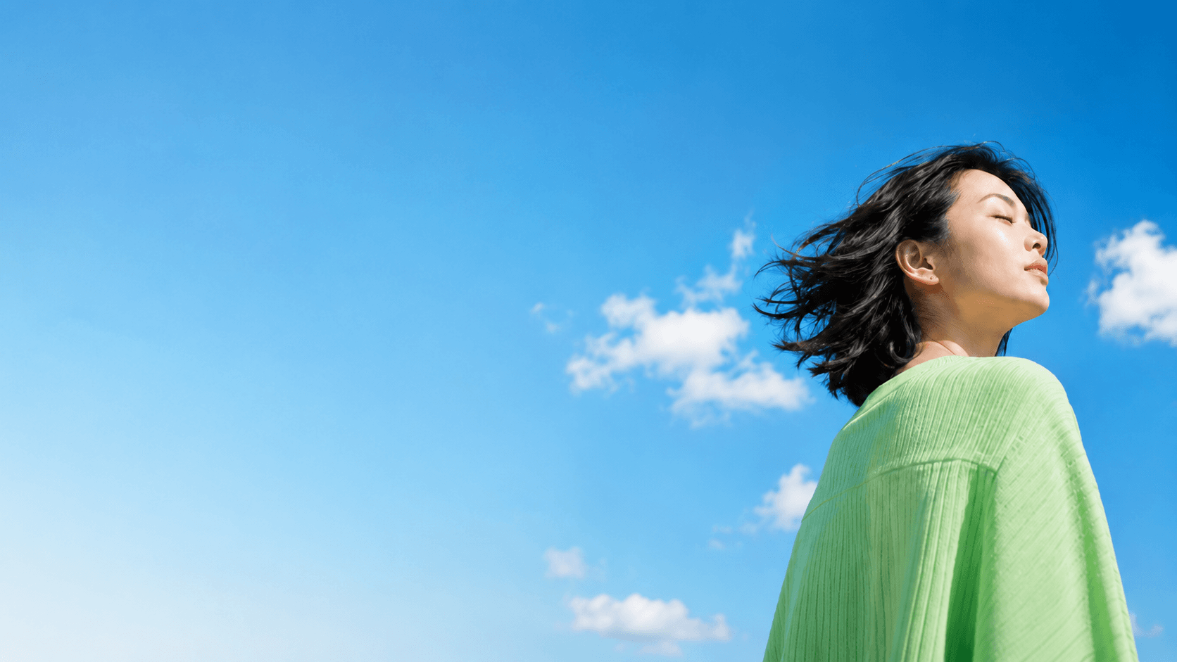 Creator standing under a bright sky