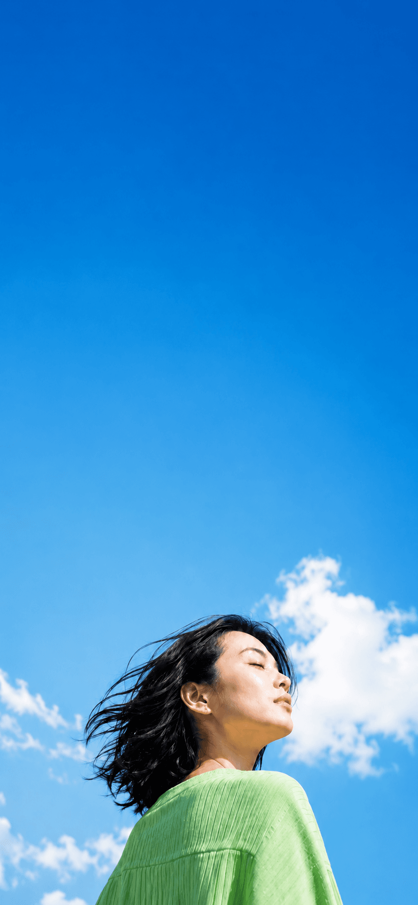 Creator standing under a bright sky